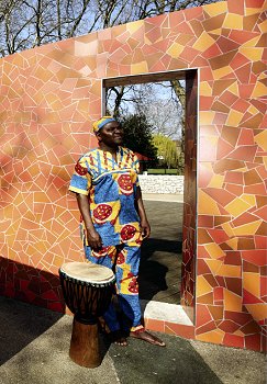 Alex next to tiled wall